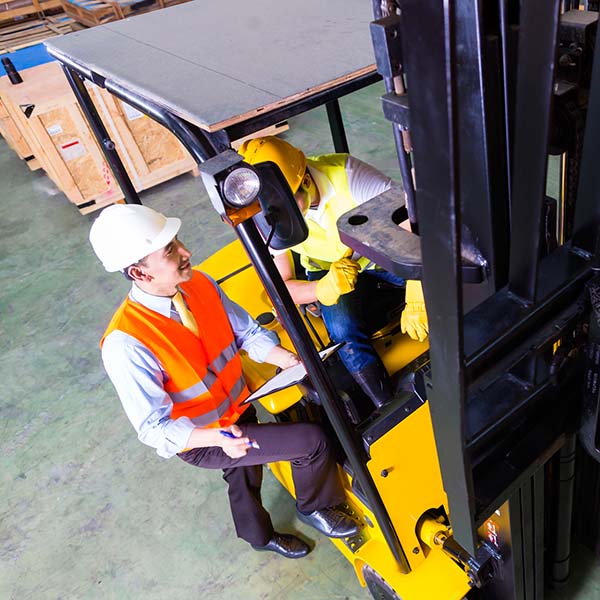 man learning how to use forklift
